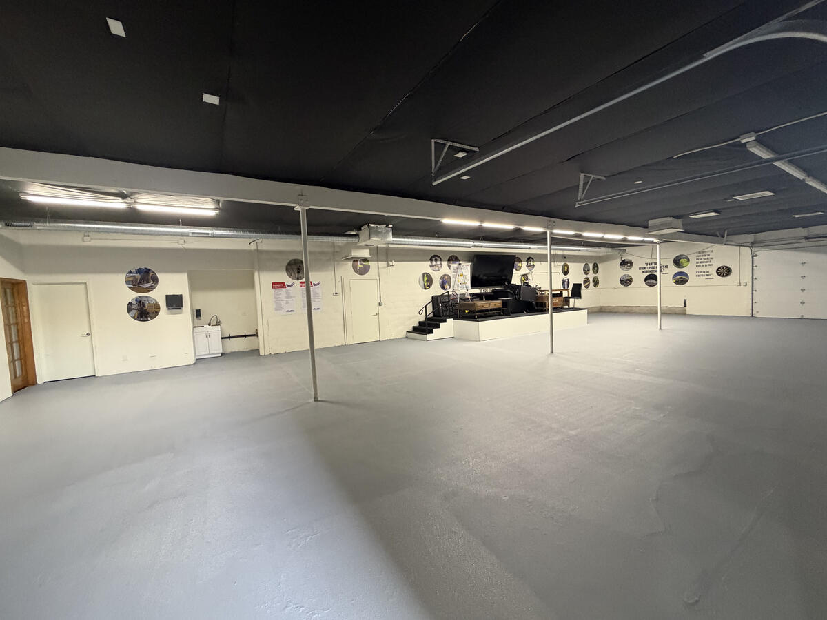 Commercial concrete floor after coating - clean grey epoxy finish